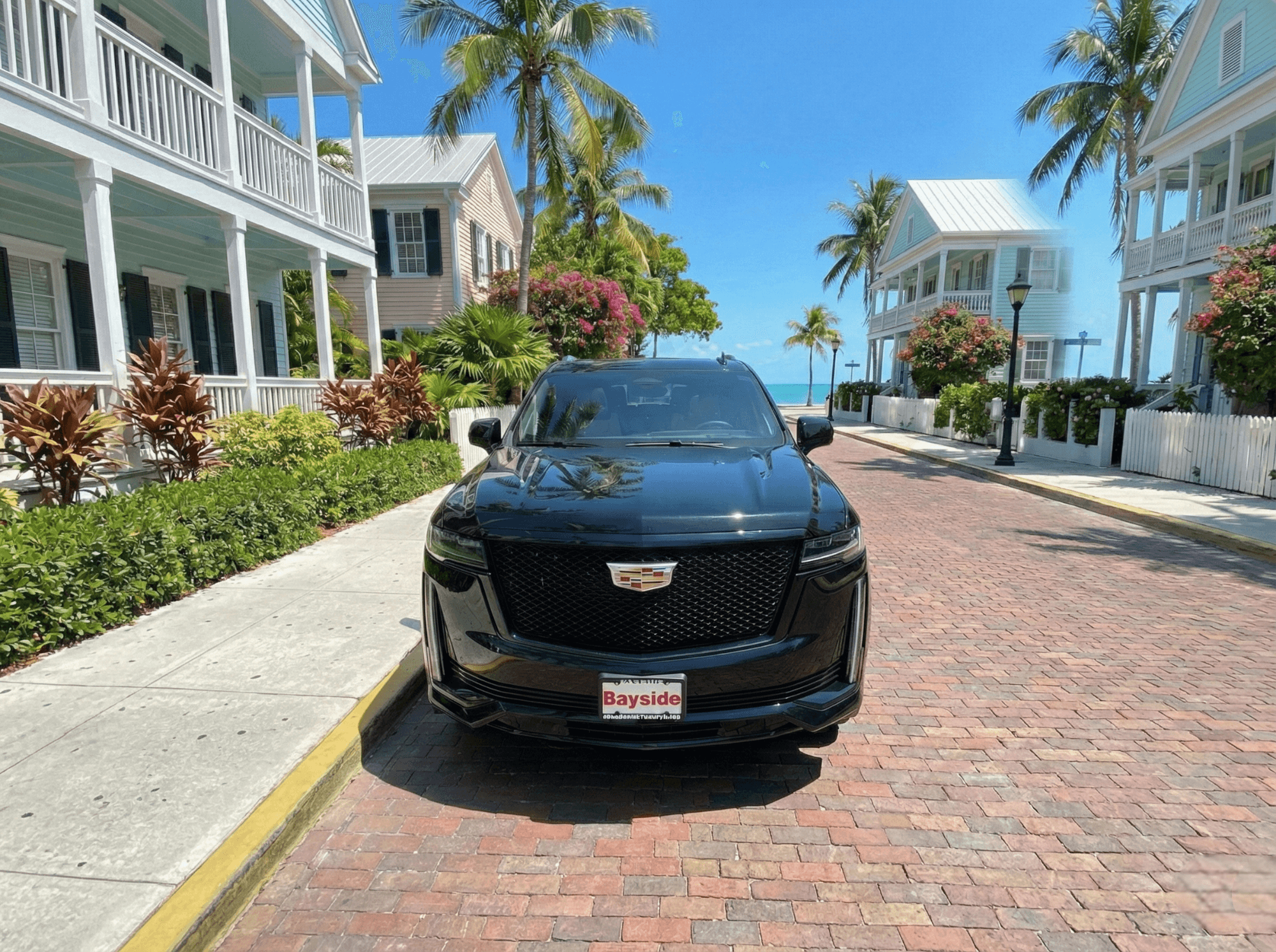 Island Spirit Cadillac Escalade on a tropical Key West street